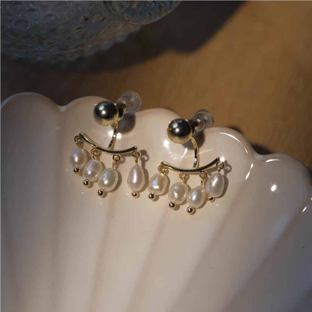 French vintage freshwater pearl tassel ear jacket earrings on shell background