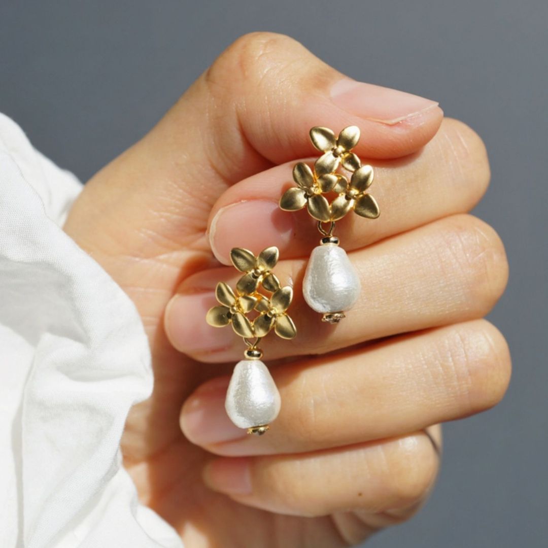 Pair of gold flower pearl earrings with teardrop pearls, ideal as wedding earrings or bridesmaid gift for a vintage-inspired look.