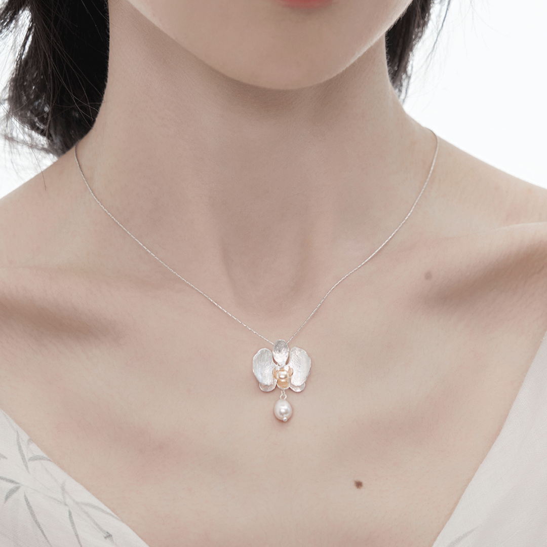 Botanical Realism Vintage Freshwater Pearl necklace worn by a model in a minimalist outfit.-1