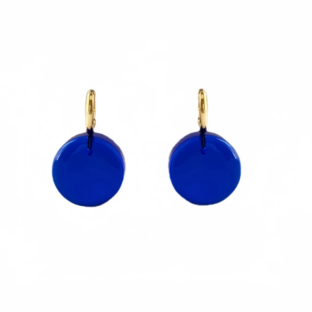 Pair of vibrant cobalt blue round glass hoop earrings on a white background.