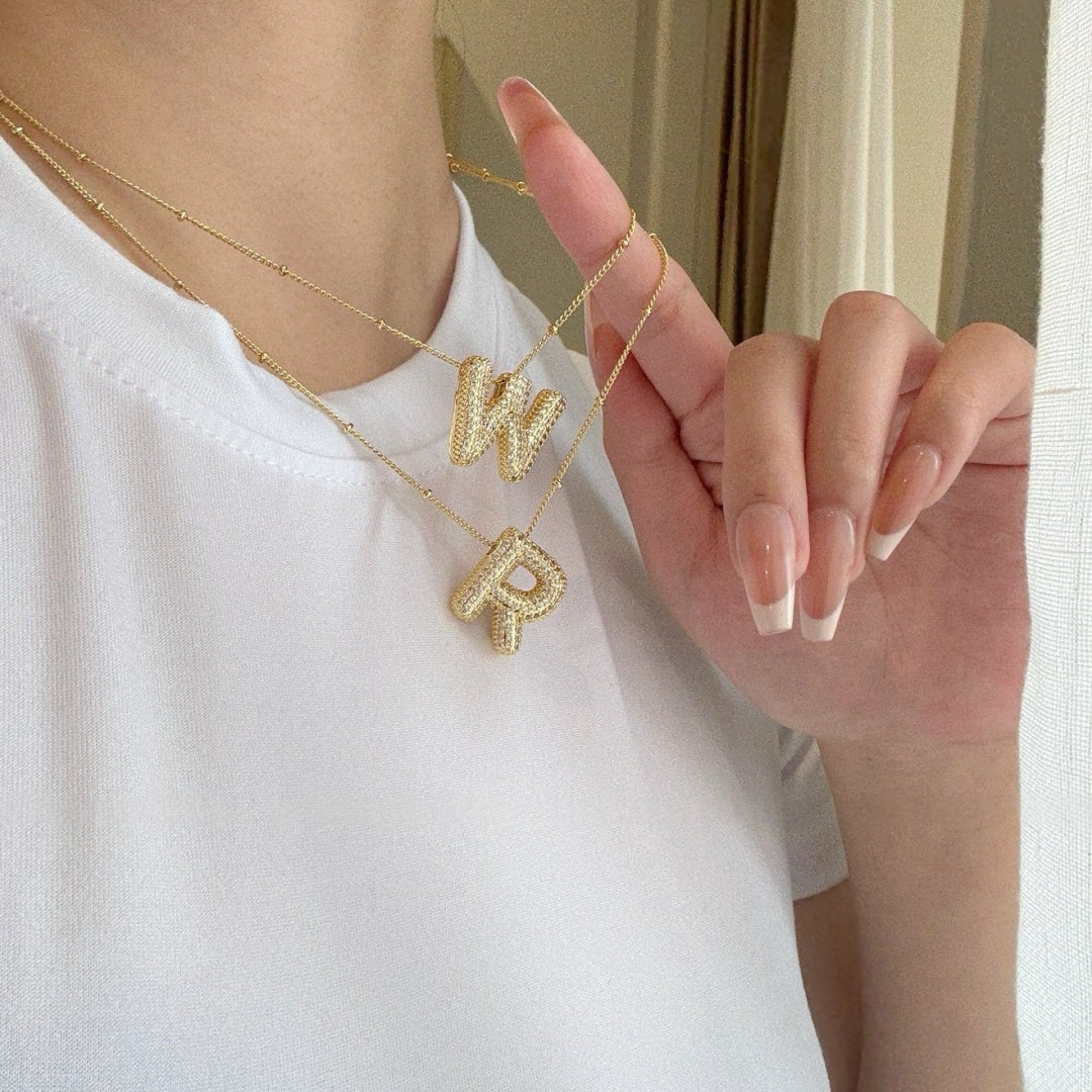 Layered puffy bubble letter necklaces for a personalized monogram style. 4