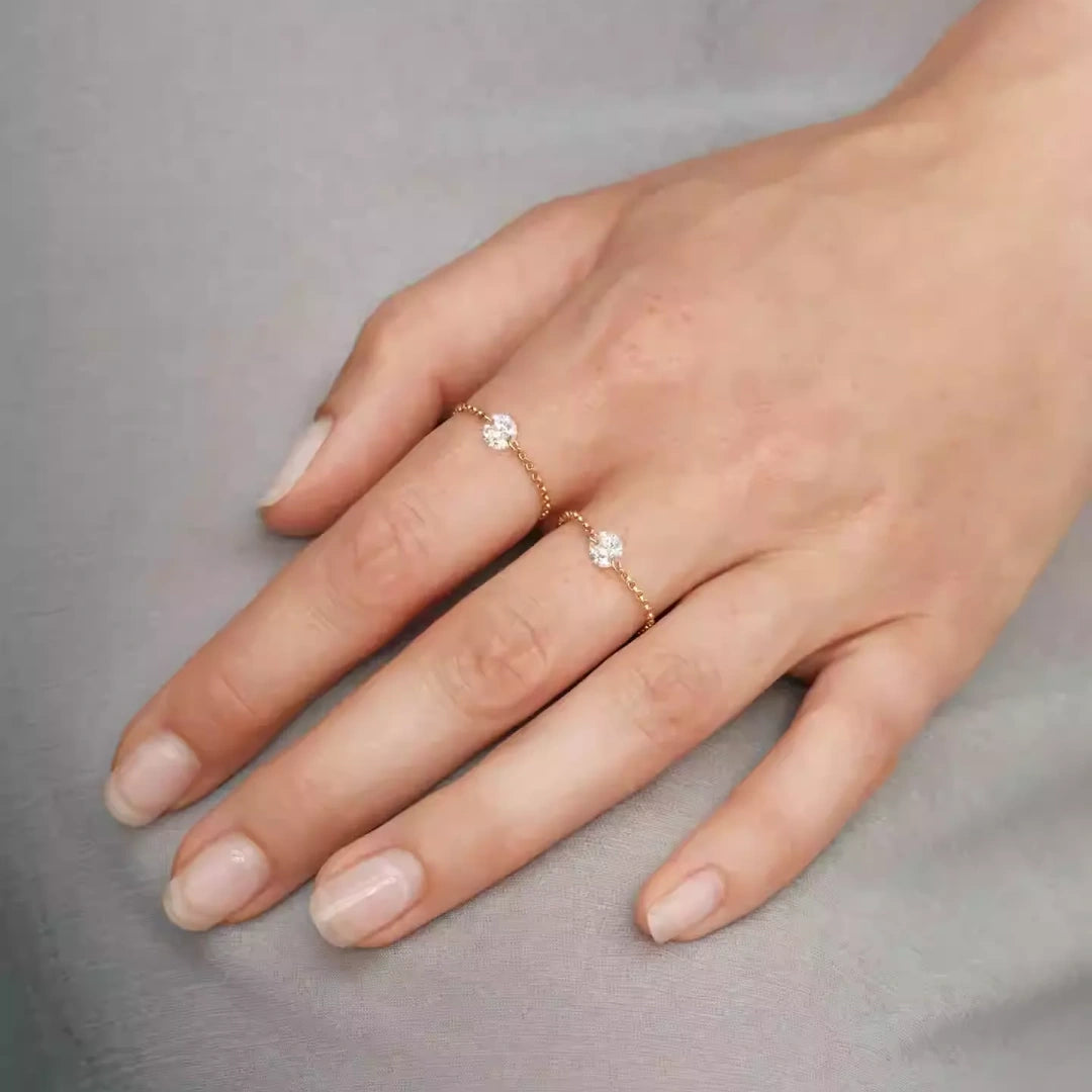 Minimalist adjustable moissanite chain ring worn on hand showing the delicate S925 gold plated soft link design.