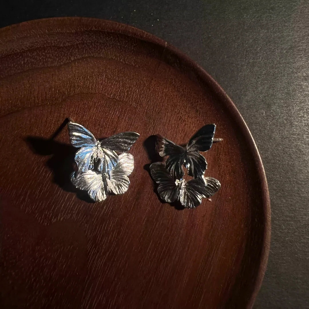 Morphic Butterfly Vintage 925 Sterling Silver earrings on a wooden display - product-studio-1