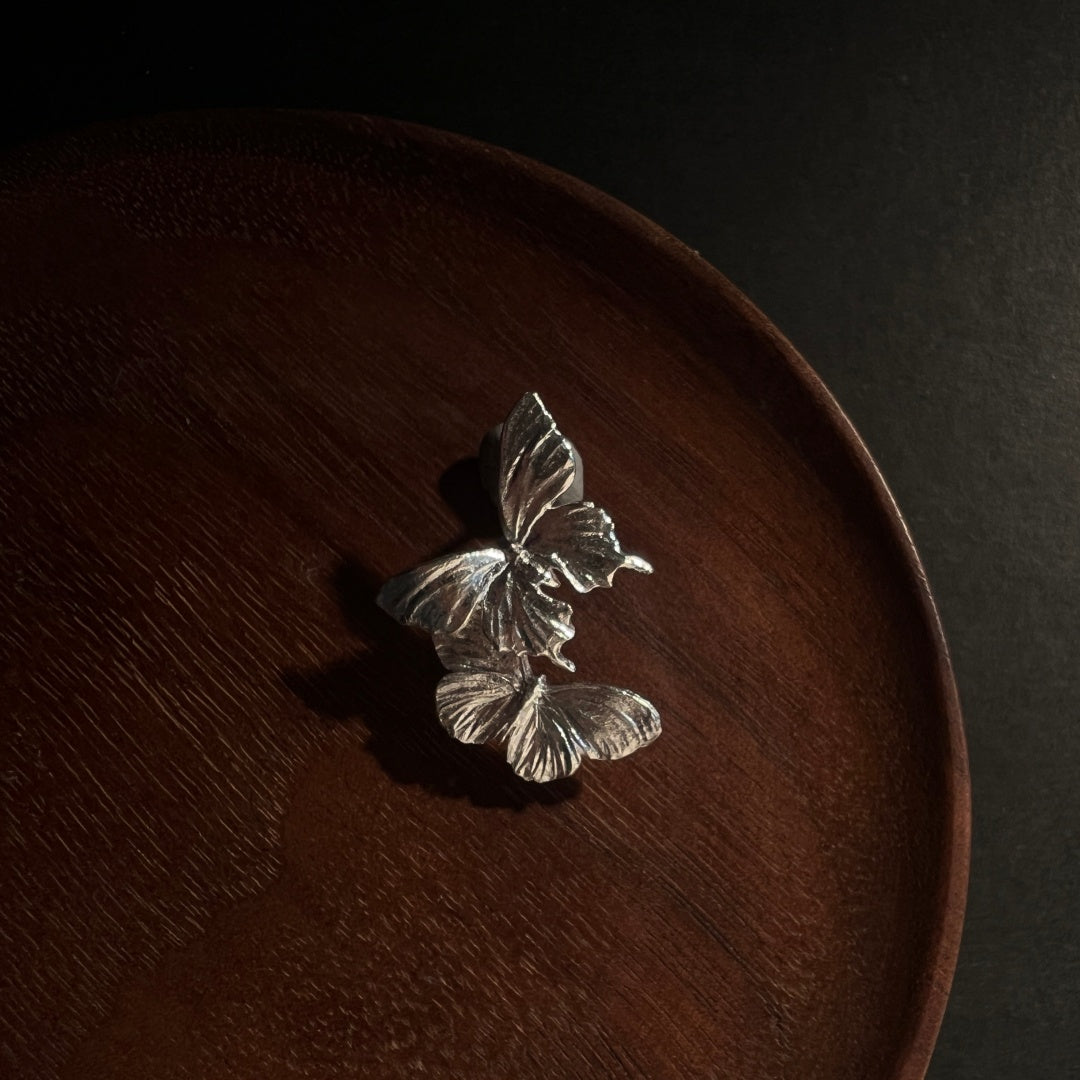 Morphic Butterfly Vintage 925 Sterling Silver earrings on a wooden display - product-studio-2