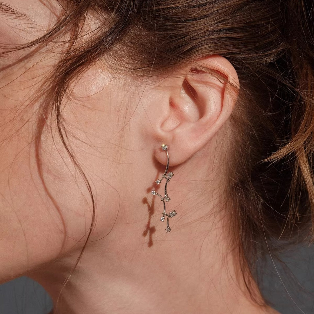 Elegant nature-inspired vine drop earrings in S925 silver featuring a swaying design to slim the face, ideal for brides. 2