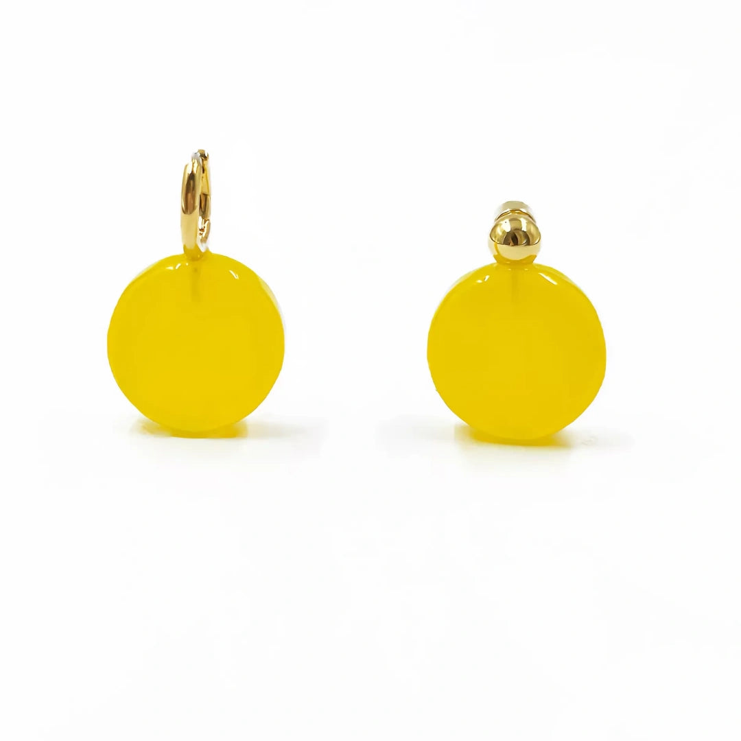 A matching pair of yellow glass hoop earrings featuring thick gold plating.