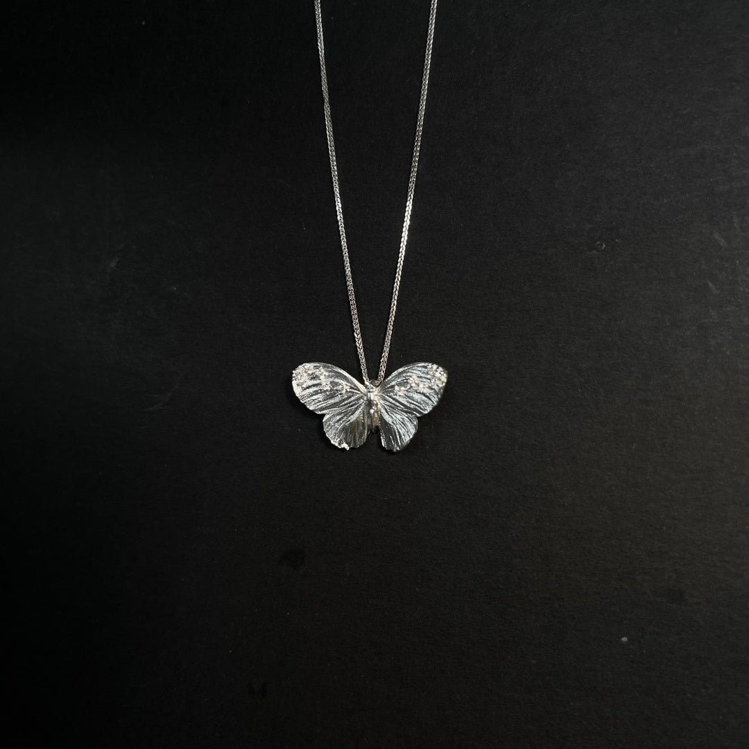 Full view of the exquisite S925 sterling silver butterfly necklace with a minimalist chain for vintage styling - product-studio-2