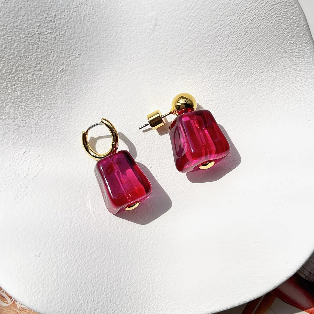 High-quality 18k gold plated studs featuring ruby red glass cubes.